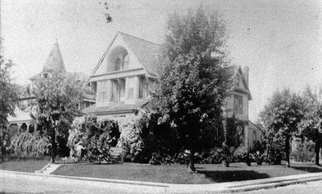 grainy view of two large Victorian houses on corner of Windsor and North Essex, Narberth