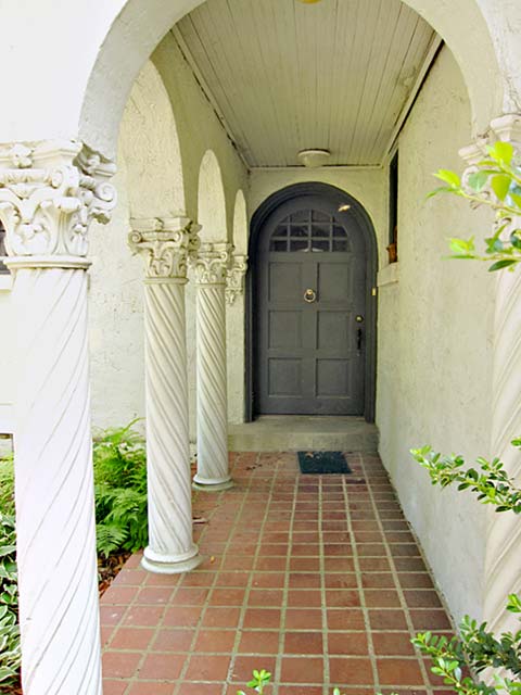 tile-paved entry, arched, corinthian columns