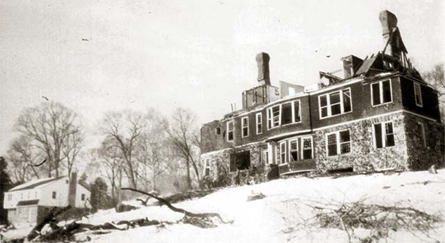 partly demolished mansion, no roof, on snowy hill
