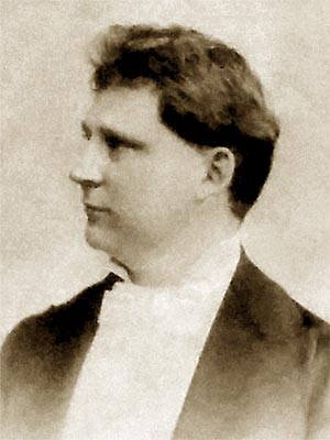three-quarter-view head and shoulders portrait of a young man in formal attire