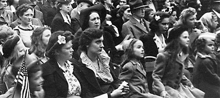 crowd of faces all looking towards the right