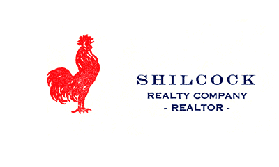 business card with bright red rooster graphic and words: Shilcock Realty Company - Realtor